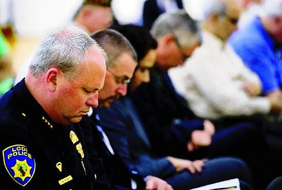 lodi_police_chief_mark_helms-bows_his_head_in_reverence_during_a_moment_of_silent_reflection..jpg
